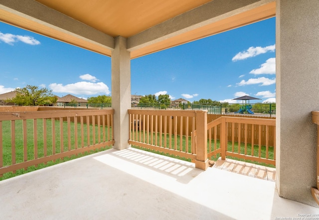 view of patio featuring a fenced backyard and a playground