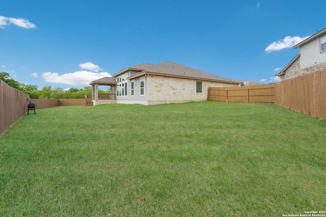 view of yard featuring a fenced backyard