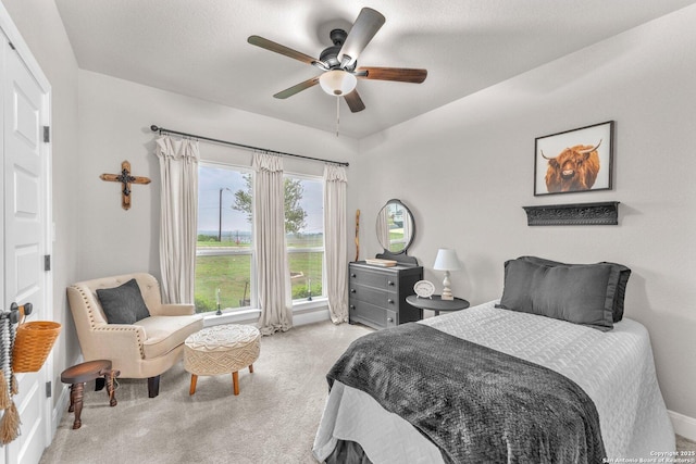 bedroom featuring carpet flooring and a ceiling fan