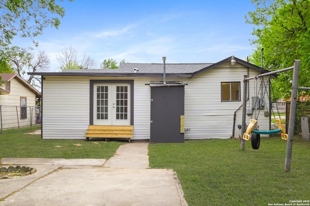 3927 W Houston, San Antonio, TX 78207 - view of front facade with french doors and a shingled roof
