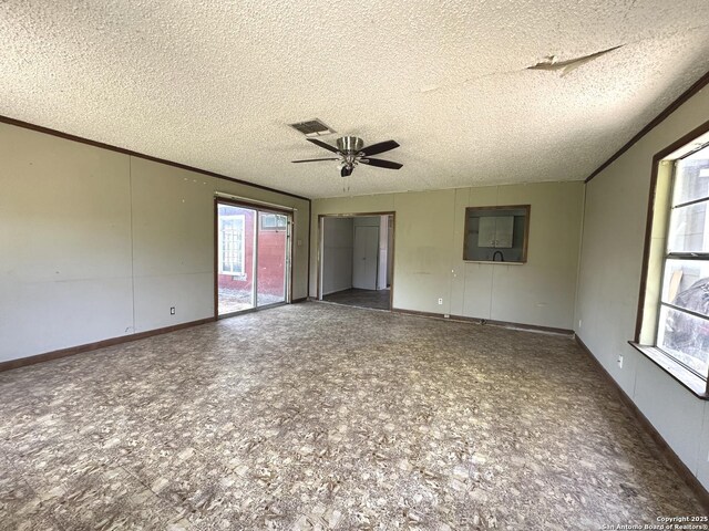 4535 Lark, San Antonio, TX 78228 - spare room featuring ceiling fan, a textured ceiling, and baseboards