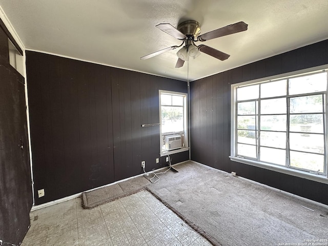 4535 Lark, San Antonio, TX 78228 - spare room featuring a ceiling fan and wooden walls