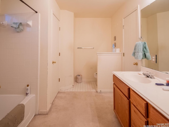 full bath featuring toilet, vanity, baseboards, and bathtub / shower combination