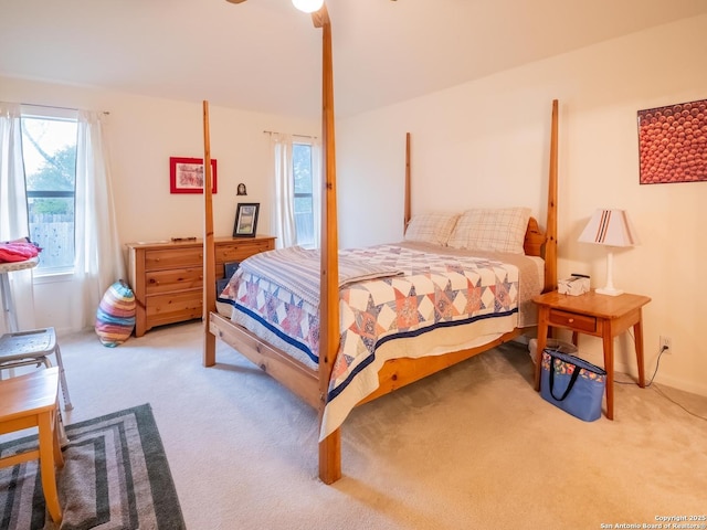 carpeted bedroom featuring a ceiling fan