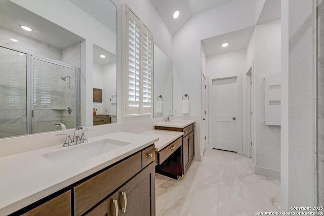 full bathroom featuring vanity, marble finish floor, recessed lighting, and a shower stall