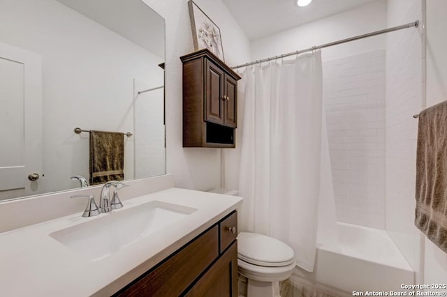 bathroom featuring shower / bath combination with curtain, toilet, and vanity