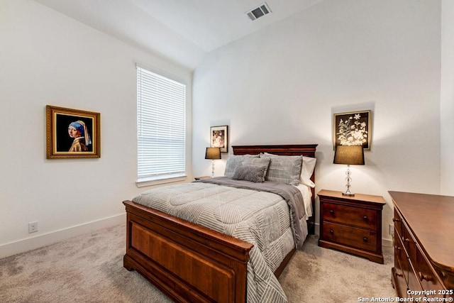 bedroom with light carpet, baseboards, lofted ceiling, and visible vents
