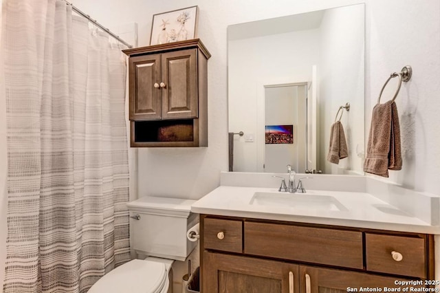 full bath featuring toilet and vanity