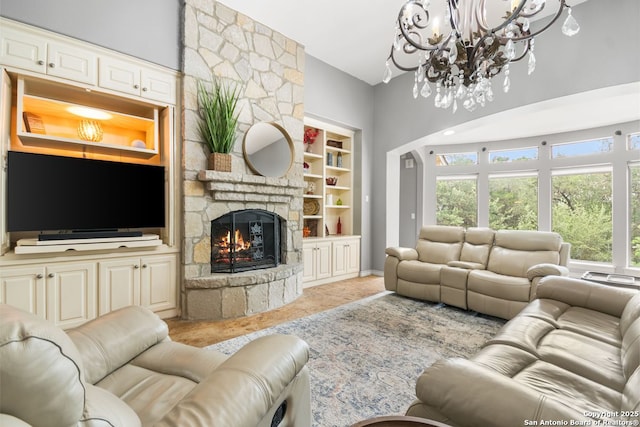 15610 Chinquapin, Helotes, TX 78023 - living room with a chandelier, a stone fireplace, built in features, baseboards, and a towering ceiling