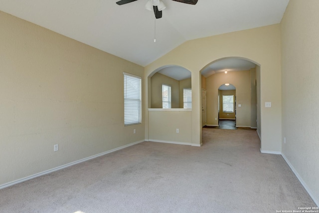 7614 Copper Dawn, Converse, TX 78109 - empty room with ceiling fan, carpet floors, vaulted ceiling, arched walkways, and baseboards