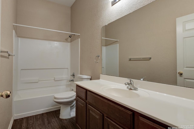 7614 Copper Dawn, Converse, TX 78109 - bathroom featuring vanity, wood finished floors, toilet, shower / bath combination, and a textured wall
