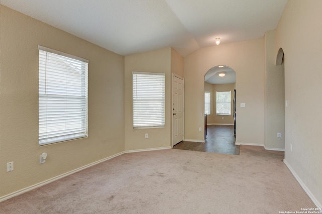 7614 Copper Dawn, Converse, TX 78109 - carpeted empty room featuring arched walkways, lofted ceiling, and baseboards