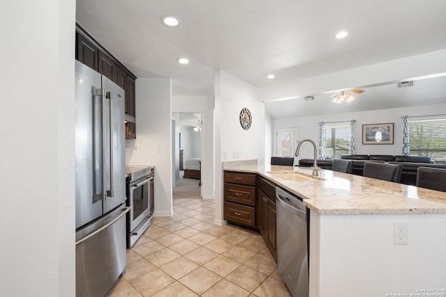 411 W Greenbriar Dr, Granite Shoals, TX 78654 - kitchen featuring visible vents, a sink, a ceiling fan, and appliances with stainless steel finishes