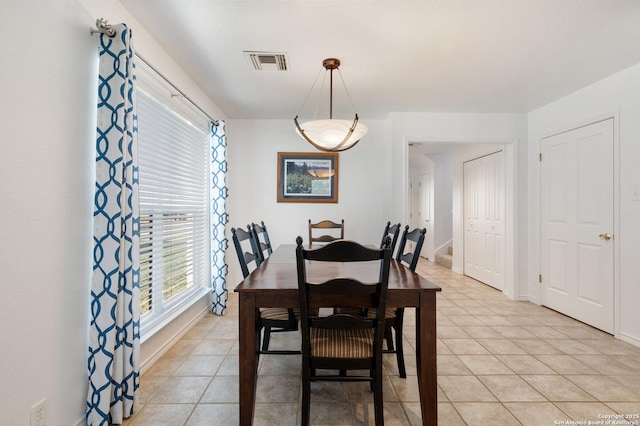 411 W Greenbriar Dr, Granite Shoals, TX 78654 - dining room with baseboards, visible vents, and light tile patterned floors