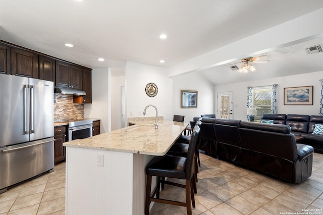 411 W Greenbriar Dr, Granite Shoals, TX 78654 - kitchen featuring visible vents, appliances with stainless steel finishes, under cabinet range hood, a sink, and open floor plan