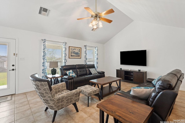 411 W Greenbriar Dr, Granite Shoals, TX 78654 - living room with visible vents, lofted ceiling, ceiling fan, and light tile patterned floors