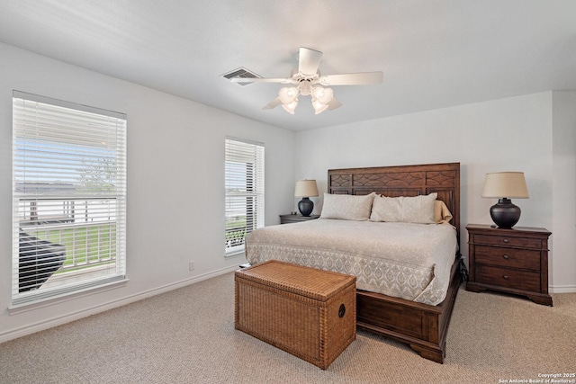 411 W Greenbriar Dr, Granite Shoals, TX 78654 - carpeted bedroom featuring baseboards, visible vents, and a ceiling fan
