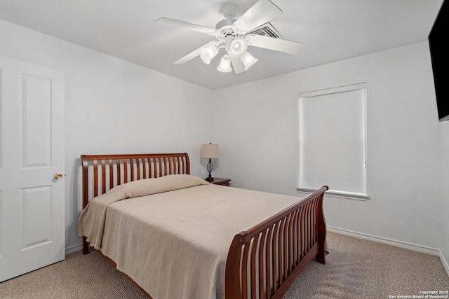411 W Greenbriar Dr, Granite Shoals, TX 78654 - bedroom with baseboards, ceiling fan, and carpet flooring