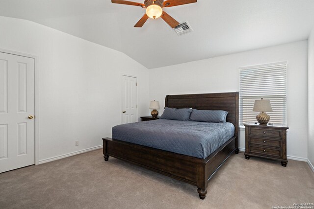 411 W Greenbriar Dr, Granite Shoals, TX 78654 - bedroom with visible vents, baseboards, a ceiling fan, vaulted ceiling, and light colored carpet