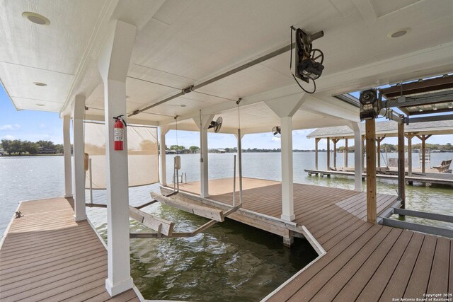 411 W Greenbriar Dr, Granite Shoals, TX 78654 - view of dock featuring boat lift and a water view