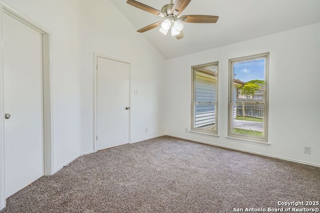 unfurnished room featuring carpet flooring, high vaulted ceiling, and a ceiling fan
