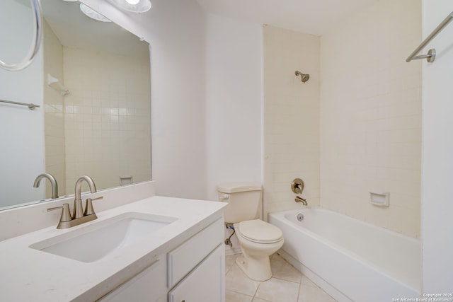 bathroom featuring toilet, tile patterned flooring, vanity, and washtub / shower combination