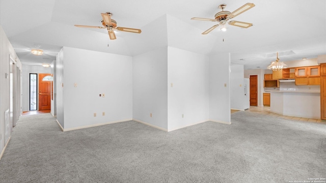 unfurnished living room featuring baseboards, ceiling fan, and light carpet