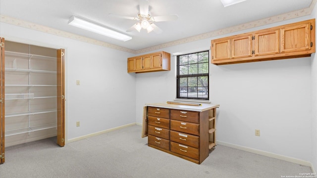 bedroom with light carpet and baseboards
