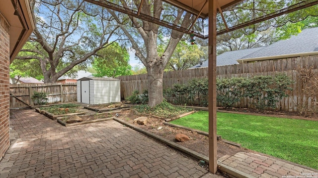 view of patio with a fenced backyard, an outbuilding, and a shed