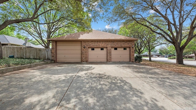 garage featuring fence