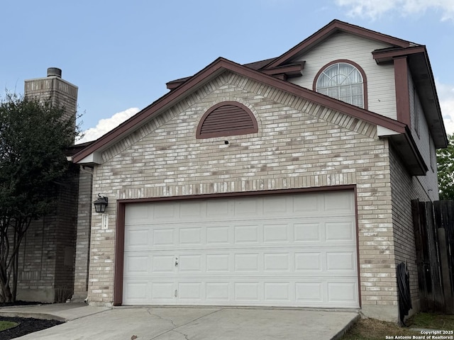 5038 Fawn Lake Dr, San Antonio, TX 78244 - garage featuring fence and concrete driveway