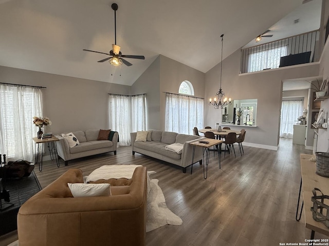 5038 Fawn Lake Dr, San Antonio, TX 78244 - living room with high vaulted ceiling, ceiling fan with notable chandelier, baseboards, and wood finished floors