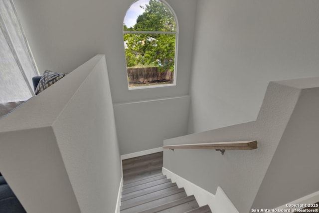 5038 Fawn Lake Dr, San Antonio, TX 78244 - stairs with baseboards and wood finished floors