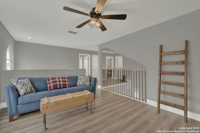 5038 Fawn Lake Dr, San Antonio, TX 78244 - living room featuring a ceiling fan, wood finished floors, baseboards, and visible vents