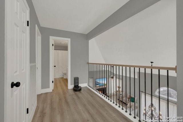 5038 Fawn Lake Dr, San Antonio, TX 78244 - hallway with baseboards, beamed ceiling, and wood finished floors