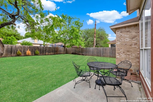 5038 Fawn Lake Dr, San Antonio, TX 78244 - view of yard featuring a fenced backyard, outdoor dining area, and a patio area