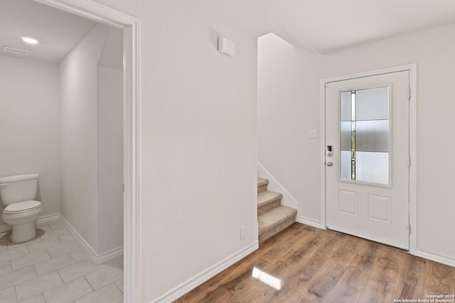 147 Festive Coquette, San Antonio, TX 78253 - foyer featuring wood finished floors, stairway, and baseboards