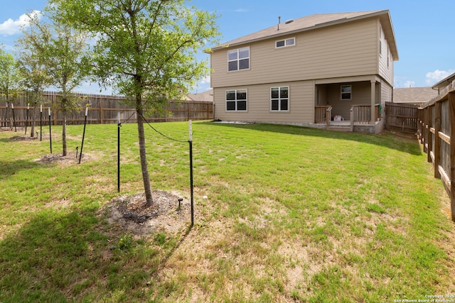 147 Festive Coquette, San Antonio, TX 78253 - rear view of house featuring a lawn and a fenced backyard