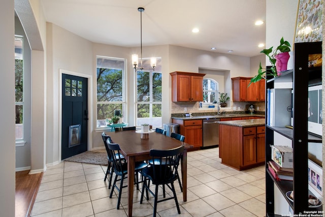 19423 Camino Rdg, San Antonio, TX 78258 - dining space with a chandelier, recessed lighting, baseboards, and light tile patterned flooring