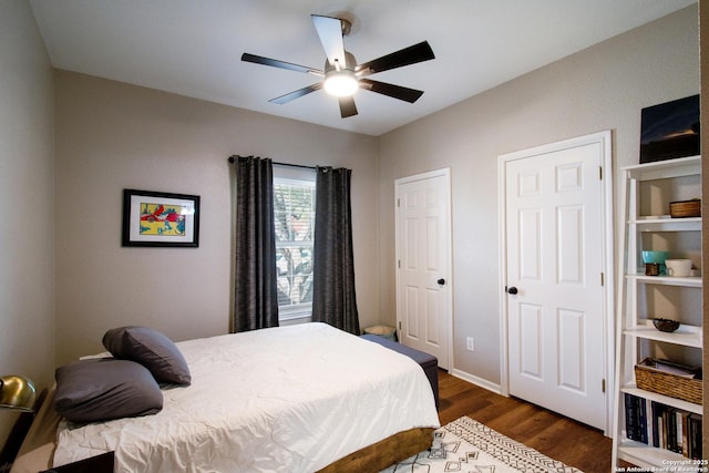 19423 Camino Rdg, San Antonio, TX 78258 - bedroom with dark wood-style flooring, ceiling fan, and baseboards