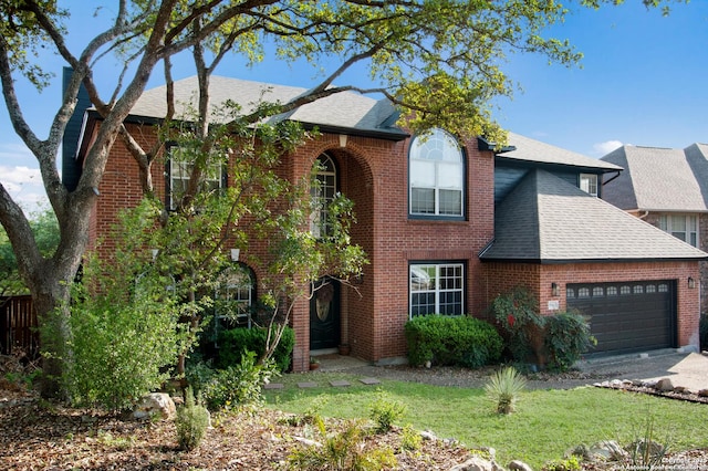 19423 Camino Rdg, San Antonio, TX 78258 - traditional-style house featuring roof with shingles, a garage, and brick siding