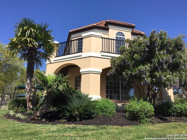 19423 Camino Rdg, San Antonio, TX 78258 - mediterranean / spanish home featuring a balcony, stucco siding, and a tile roof