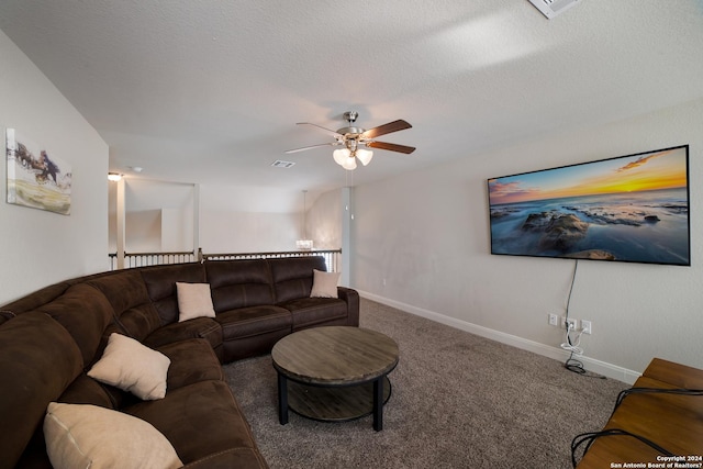 carpeted living area with baseboards, visible vents, ceiling fan, and a textured ceiling