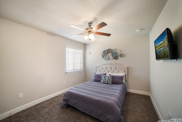 carpeted bedroom with baseboards and ceiling fan