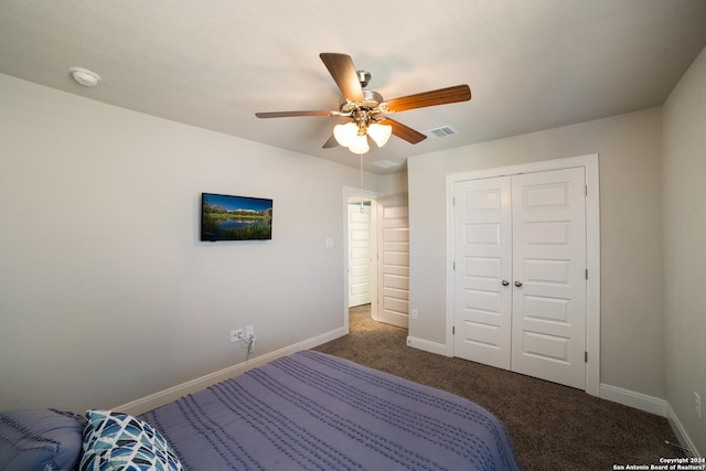 bedroom featuring carpet floors, a closet, baseboards, and visible vents