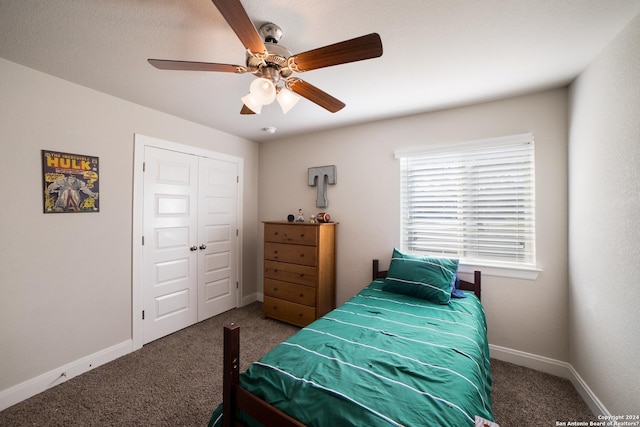 bedroom with a ceiling fan, carpet floors, baseboards, and a closet
