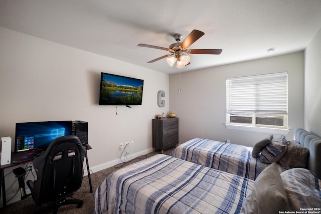 bedroom featuring baseboards, carpet, and a ceiling fan