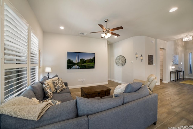 living area featuring ceiling fan, visible vents, recessed lighting, and wood finished floors