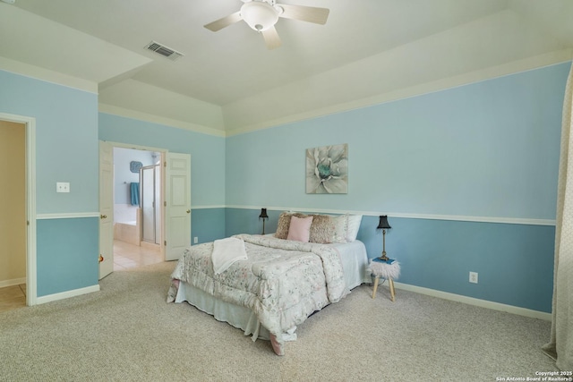 carpeted bedroom featuring connected bathroom, a ceiling fan, baseboards, and visible vents
