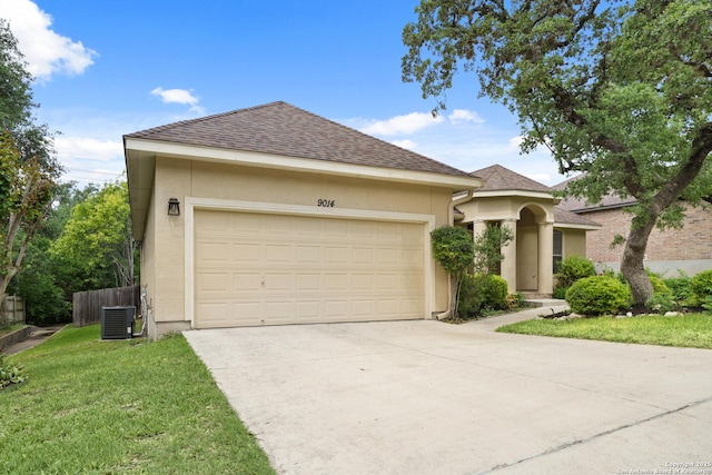 view of front of property with an attached garage, a shingled roof, stucco siding, concrete driveway, and central air condition unit